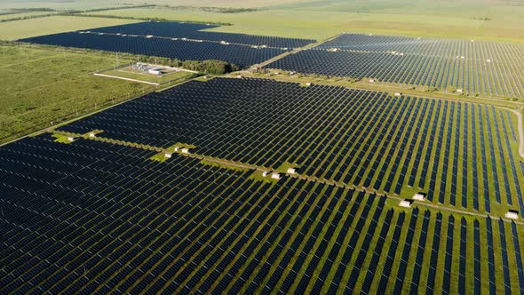 Solar Power Station in Green Field on Sunny Day