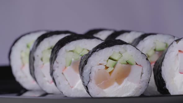 Sushi Roll Turned on a Pink Background