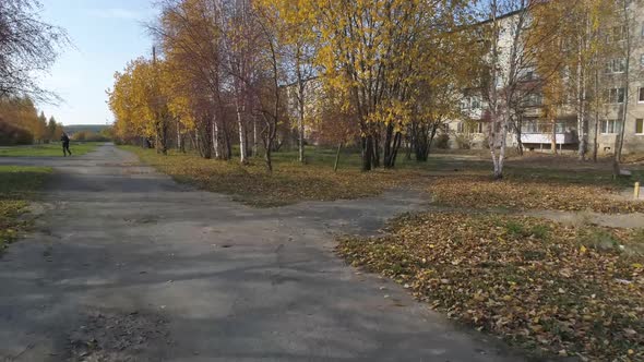 Drone view of alley in provincial city with soviet panel houses 30