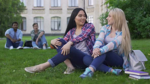 Females Sitting on Grass, Talking and Smiling, Guys Looking at Girls, Flirt