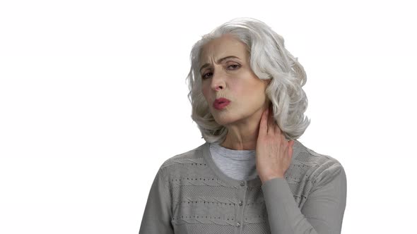 Mature Woman Suffers From Neck Ache Close Up