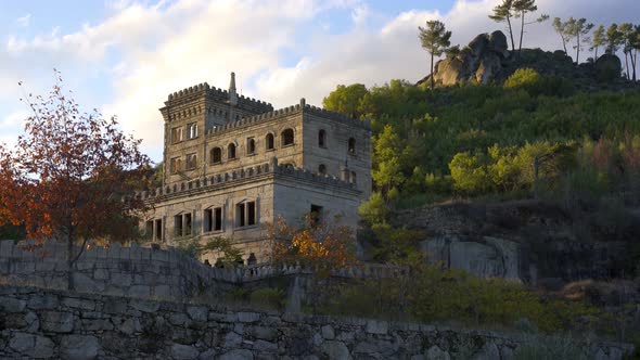 Abandoned ruin building of Termas Radium Hotel Serra da Pena in Sortelha with beautoful colorful tre