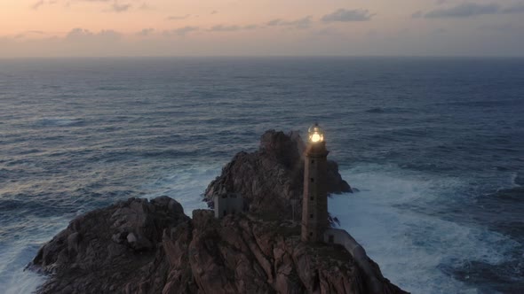 Lit Lighthouse at Dusk in Cape Vilan Galicia Spain Aerial View