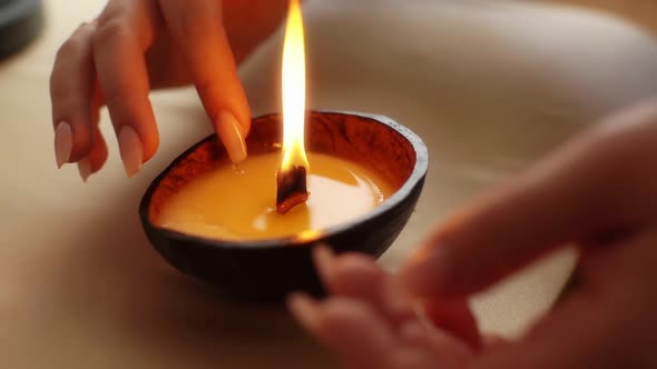 Closeup Cropped Shot of Unrecognizable Female Applying Melted Wax From Burning Handmade Candle on