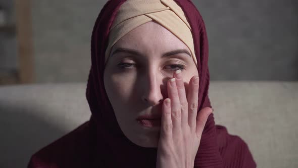 Portrait of a Crying Young Muslim Woman