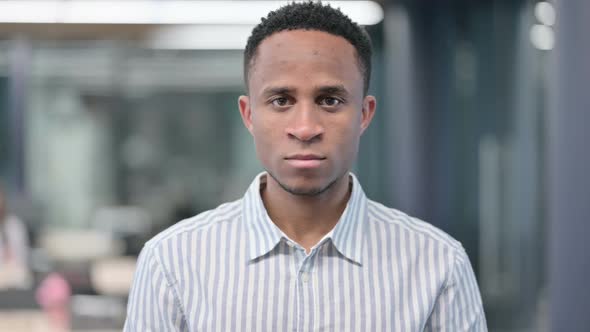 African Businessman Looking at Camera