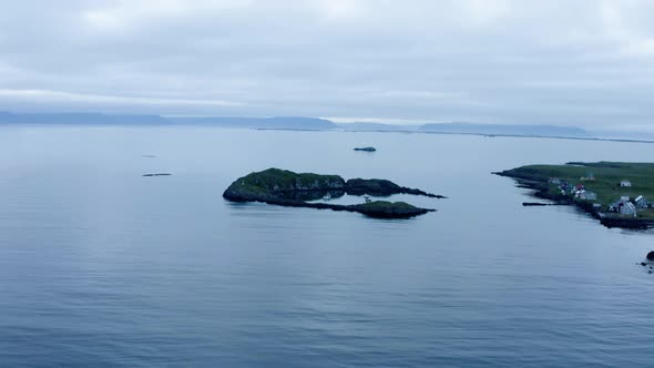 Panoramic View Over Serene Seascape With Boats Dock Near Flatey Island Shoreline In Iceland. Aerial