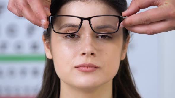 Sales Manager Wearing Glasses on Smiling Womans Face, Eyewear Fitting, Size