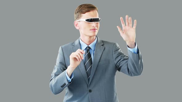 Businessman in virtual video glasses using digital screen