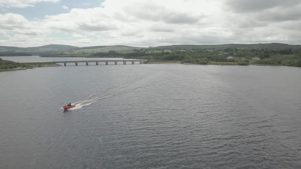 Motorboat Speeding On Blessington Lake (Poulaphouca Reservoir) In Wicklow, Ireland On A Cloudy Day.