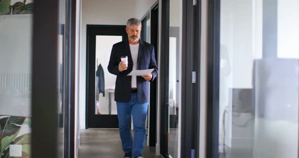 Businessman with Coffee Cup Checking Document 4k