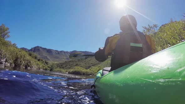 Woman kayaking in lake at countryside 4k