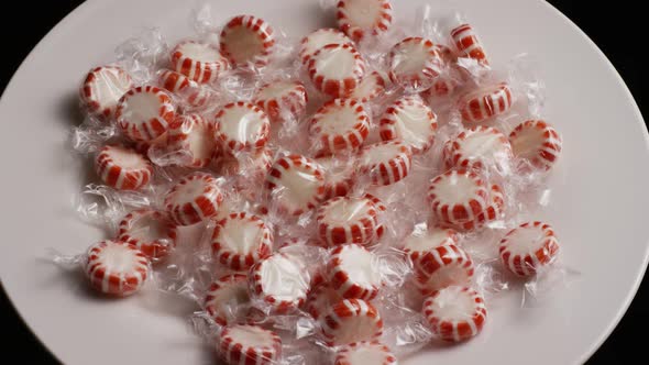 Rotating shot of peppermint candies - CANDY PEPPERMINT 