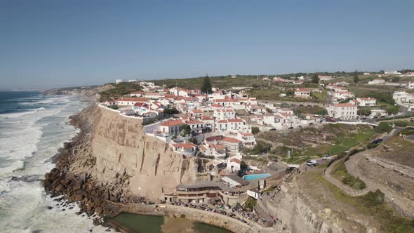 Establishing pan shot overlooking parish town on top of the cliff in Azenhas do Mar