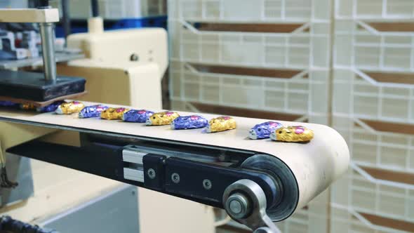 Wrapped Candies Lying on Conveyor