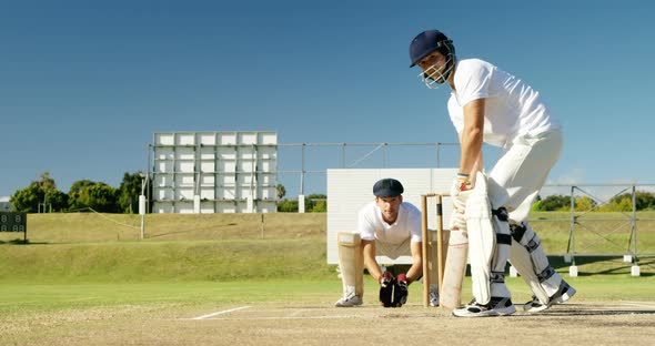 Batsman hitting a ball during cricket match