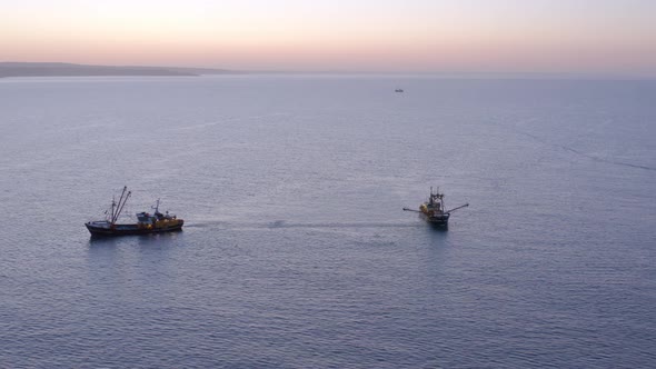 Fishing Trawlers at Sunrise Seen From the Air