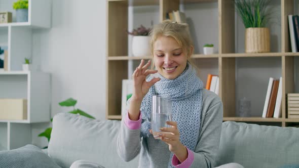 Sick Ill Woman Drops Effervescent Aspirin Pill Tablet Into Glass with Water