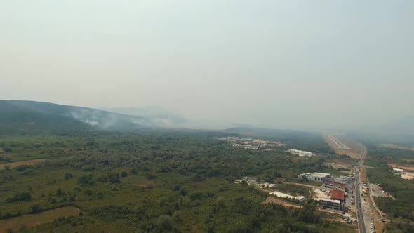 Drone View of the Highway and Buildings in the Mountains Shrouded in Haze From Fires