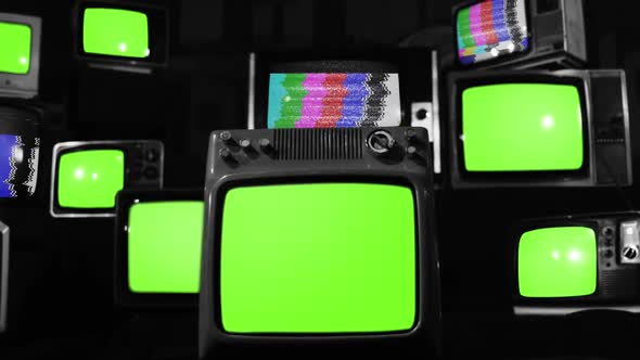 Old Televisions turning on and off Green Screens with Color Bars. Black and White.