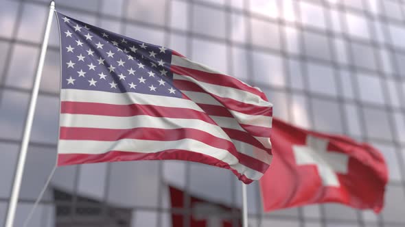 Flags of the United States and Switzerland in Front of a Skyscraper