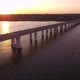 Aerial Shot of a Lengthy Bridge Covering the Dnipro at Splendid Sunset in Summer - VideoHive Item for Sale