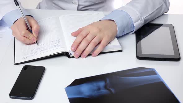 Doctor Notes Something in Notebook, White