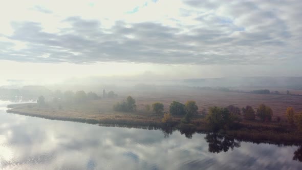landscape river near the hills. autumn, morning, fog. Aerial view.