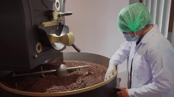 Factory Worker Checking Roasted Coffee Beans