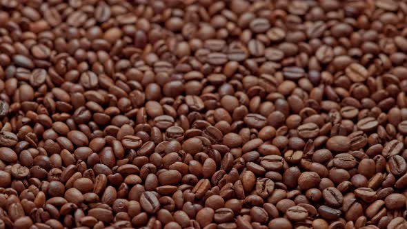 Full Frame Looped Spinning Background of Roasted Coffee Beans