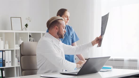 Professional medical doctors working in hospital office. Physician and the young nurse.