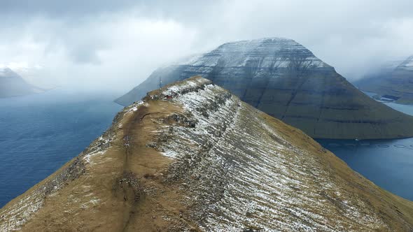 Flying Towards the Island of Kalsoy Over the Klakkur Mountain on Faroe Islands