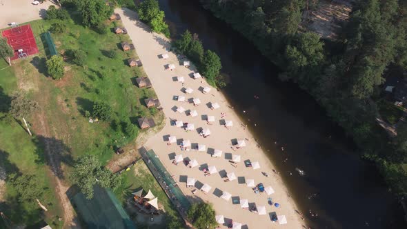 Aerial Top View of River Sand Beach with Lounges and Umbrellas