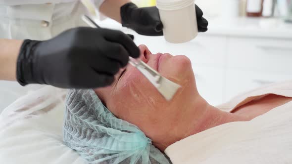 Woman Receiving HUFU Therapy High Intensity Focused Ultrasound Treatment on Face