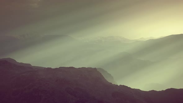 Black Rocky Mountain Silhouette in Deep Fog