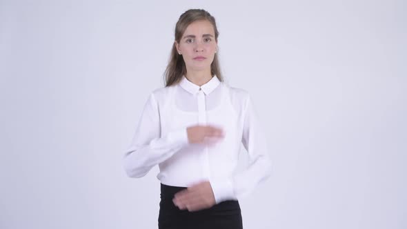 Young Pregnant Businesswoman Showing Stop Gesture Using Arms