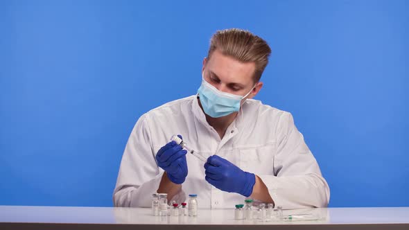 A Pharmaceutical Scientist Fills a Syringe with the Covid19 Coronavirus Vaccine