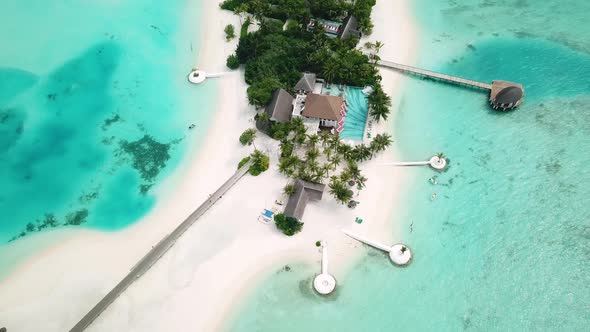 Aerial Drone View of a Beautiful Atoll or Island with a Resort in the Maldives