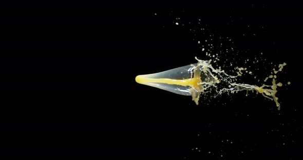 Orange Juice Exploding and Splashing on Black Background, Slow Motion 4K