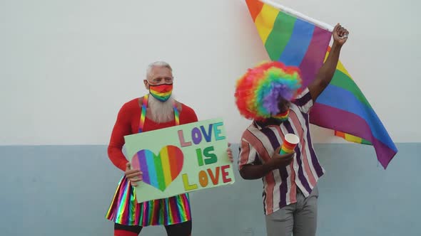 Activist people with different age and ethnicity having fun celebrating gay pride festival