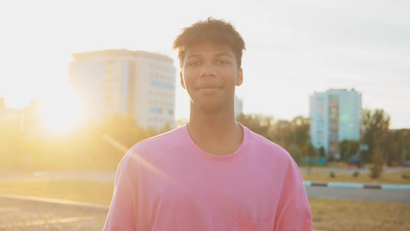 Portrait of Youth Black American Man Very Happy Smiling in Urban Background