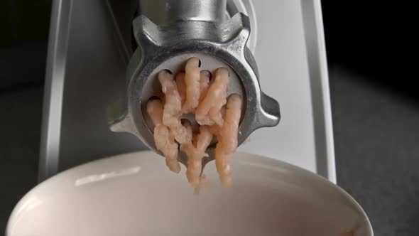 Cooking Minced Meat on an Electric Meat Grinder From Meat Closeup