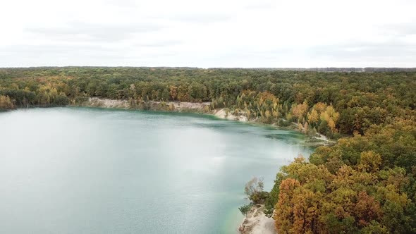 Forest lake landscape. Aerial view with drone of green forest and lake