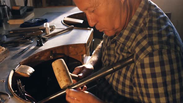 Goldsmith preparing work tool