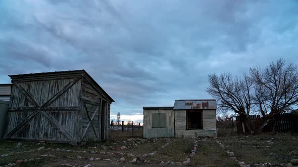 Colorful timelapse sunset with old wood shed and chicken coop in Afton