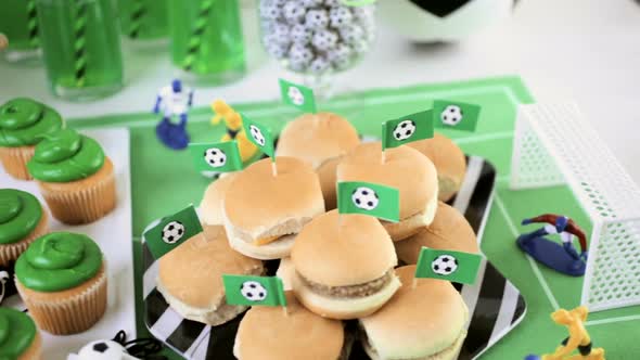 Kids football party set with snacks and drinks.