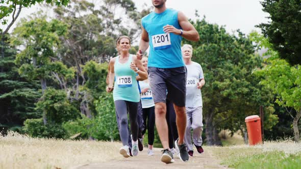 Athletes running race in the park