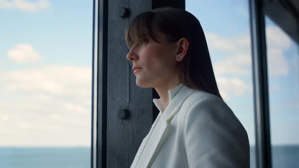 Business Partner Looking Window in Suit Close Up