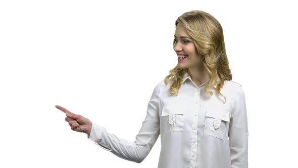 Smiling Business Woman Pointing with Finger to Copy Space