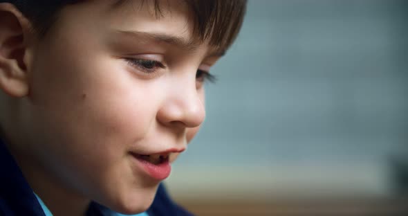 The boy is carefully considering something. The boy's head is with fair skin. sympathetic guy